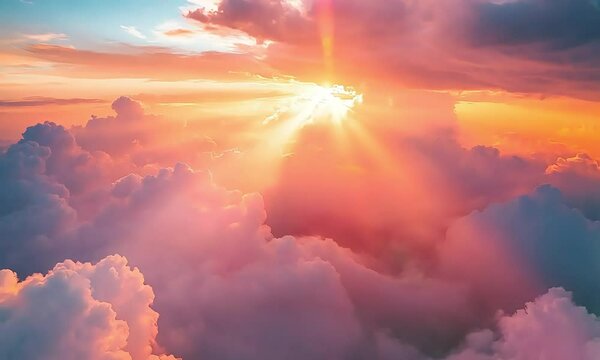 A gentle sunrise with pastel colors lighting up the sky above the clouds.
