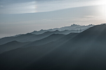 Fototapeta premium view of green hill at sunrise