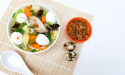 Sop Sayur or Indonesian vegetables soup, made from carrot, cabbage, potato, meatball and quail eggs.
