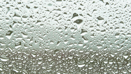 Water droplets sticking to the windshield in the rain