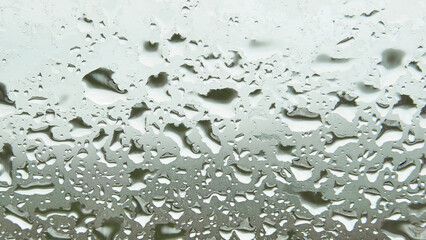 Water droplets sticking to the windshield in the rain