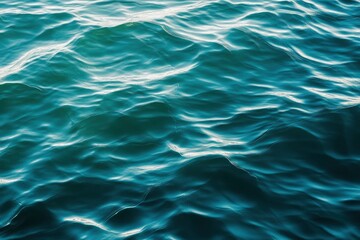 Fototapeta premium Blue green surface of the ocean in Catalina Island California with gentle ripples on the surface and light refracting , ai