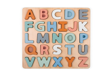Colorful wooden alphabet letters on white background