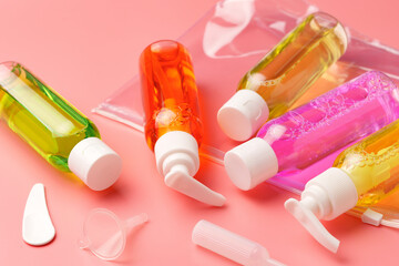 Clear Plastic Bag Containing Travel-Sized Toiletries on Pink Background