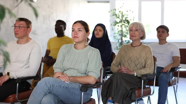 Portrait of students of different years and of different nationalities on training session in lecture hall