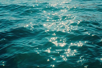 Blue green surface of the ocean in Catalina Island California with gentle ripples on the surface and light refracting , ai