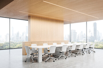 Light office room interior with meeting table and armchairs, panoramic window