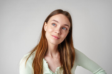 Young Woman With Long Brown Hair and Blue Eyes