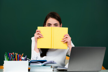 Student in high school classroom. Knowledge in high school. High school or university concept. Young College student study near blackboard. Education concept. Lesson and homework in high school.