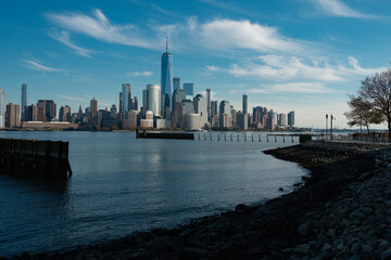 Obraz premium New York, United States. New York city skyline in Midtown Manhattan. USA, NYC, NY, Manhattan. American big city. Lower Manhattan skyline. New York from New Jersey. Downtown Manhattan with blue sky.