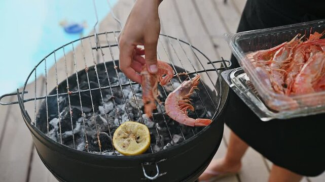 Seafood barbecue with fresh prawns on a grill by the poolside, capturing a perfect summer outdoor cooking experience