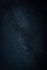 Meteor in a dark blue starry sky
