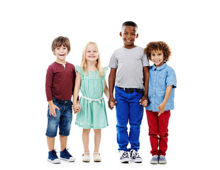 Kids, group and portrait of friends in studio with smile, bonding and diversity in weekend fashion together. Growth, development and holding hands in style, trendy clothes and fun on white background