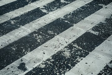 Top view of asphalted road with pedestrian crossing and stripes.