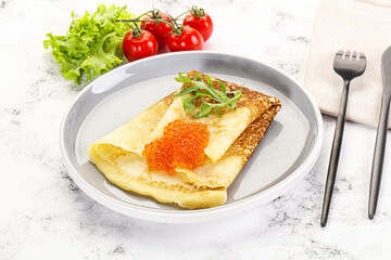 Russian pancake with red caviar
