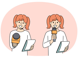 Little girl reporter with microphone smiling participating in shooting of educational TV show for children. Schoolgirl dreams of becoming reporter and working for television to interview celebrities.