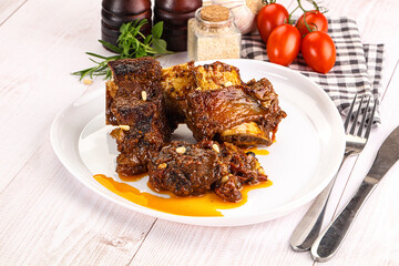 Prepared tasty beef ribs with sauce