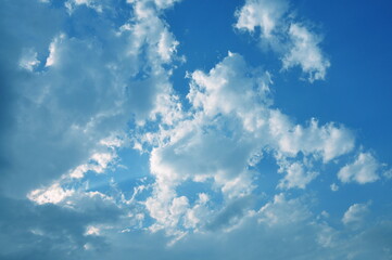 White clouds in blue sky at sunny day