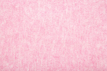 Light white pink soft knitted fabric background. Empty place for text. Closeup. Top down view.