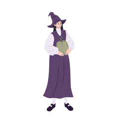 Girl in witch costume with pumpkin in hands. Halloween costume. 