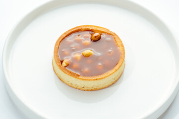 dessert in a clear glass with berries, cream and chocolate