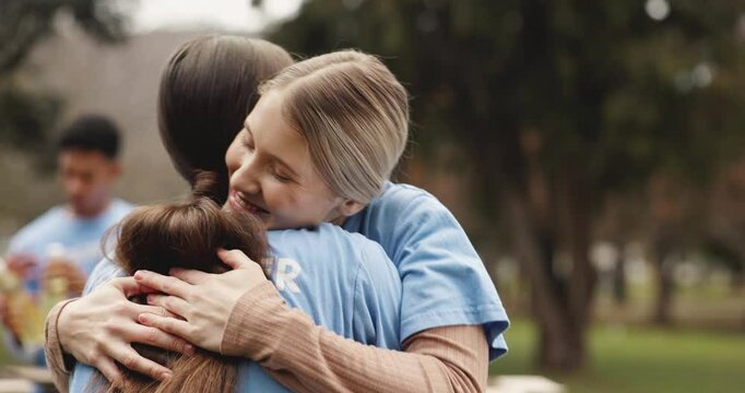 Hug, friends and women volunteers in nature with greeting, thank you or appreciation for charity. Happy, outdoor and ngo employees embracing with love in park for community outreach project together.