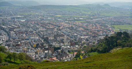 view from high from great orme across a valley overlooking Llandudno, a large Welsh townn 