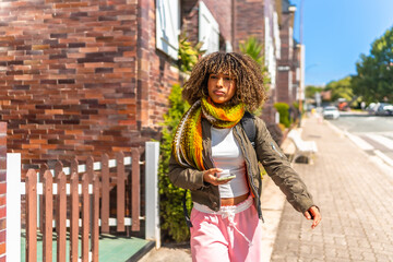 Obraz premium Latin student leaving the house and walking