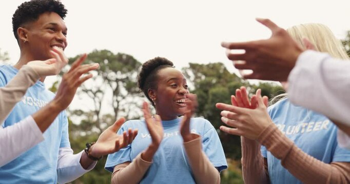 Clapping hands, fist bump and volunteers in outdoor park with achievement for outreach program. Happy, applause and ngo team cheering for community service partnership in nature for sustainability.