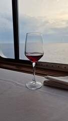 Glass of red wine on a cruise ship