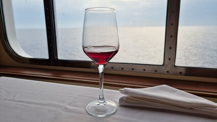 Glass of red wine on a cruise ship