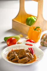 red beef stew Goulashg on table in a plate restaurant menu shoot
