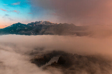 Fototapeta premium Dramatic sunrise on Adda river with Resegone peak on background, Italy landscape