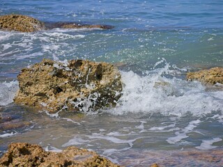 Ocean waves hitting a rock