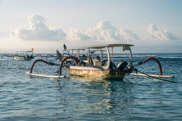 Fototapeta premium Close-up of local people's wooden boats on Lembongan Island in Bali, Indonesia at sunset