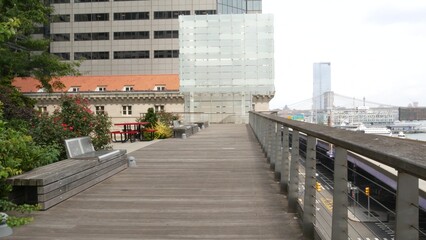 New York City waterfront park, Financial district, Manhattan Downtown riverfront Elevated Acre, Water street. Highway along East river, waterside FDR drive. Brooklyn Bridge, United States architecture