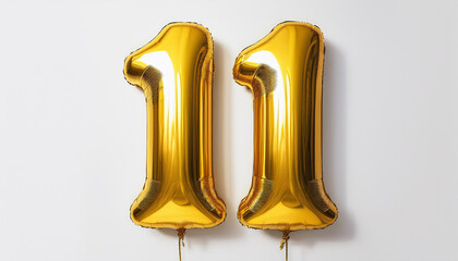 Gold birthday / anniversary balloon, number 11, white background