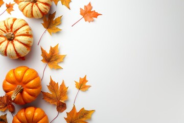 Autumn decoration with orange pumpkins and leaves on a white table. Seasonal fall background concept.