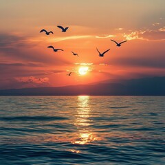 Obraz premium Sunset over the water with birds flying against sunlight on the Mediterranean Sea
