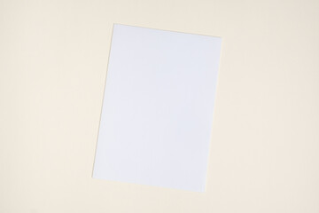 Blank Sheet of Paper on Beige Background, Top View, Space for Text