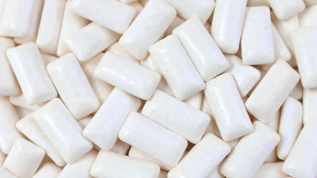 White chewing gum pads texture circle rotation close up top view
