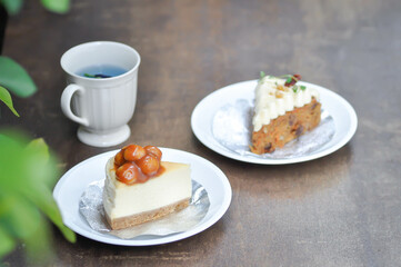 carrot cake with cream and walnut topping ,caramel macadamia cheesecake and butterfly pea tea