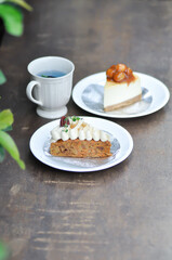 carrot cake with cream and walnut topping ,caramel macadamia cheesecake and butterfly pea tea