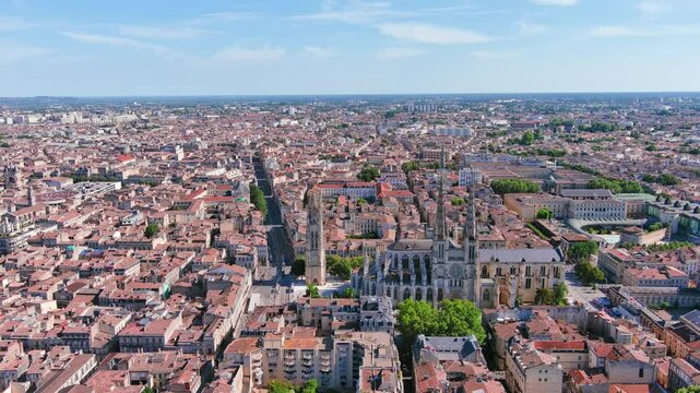 Bordeaux, France: Aerial view of famous French historic city, cathedral Cath&eacute;drale Saint-Andr&eacute; de Bordeaux and Pey Berland Tower, summer day with blue sky - landscape panorama of Europe from above
