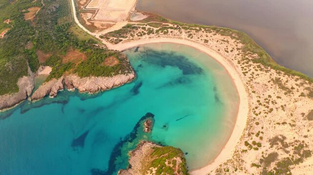 4k drone flying over footage (Ultra High Definition) of Voidokilia Beach with Old Navarino Castle. Colorfiul summser seascpae of Ionian sea. Nice sunrise on Peloponnese peninsula, Greece.