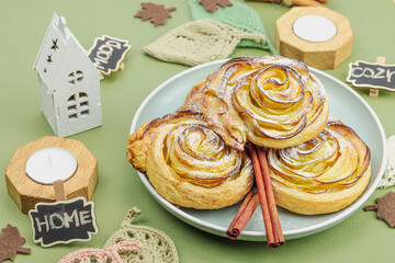 Apple roses pie with sugar powder. Traditional autumn baking, fall decor, flat lay