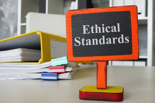 Ethical standards sign on an office desk. Integrity and professional ethics.