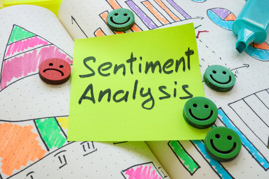 Graphs, smiley faces, and the note sentiment analysis. Emotional insights concept.