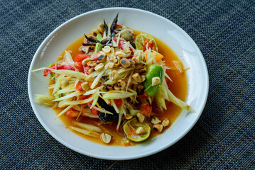 Thai food menu close-up, Thai street food dish with the taste of hot and spicy, Thai papaya salad, Som tum in Thai.