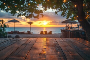 Empty wooden table with blurred beach bar at sunset
